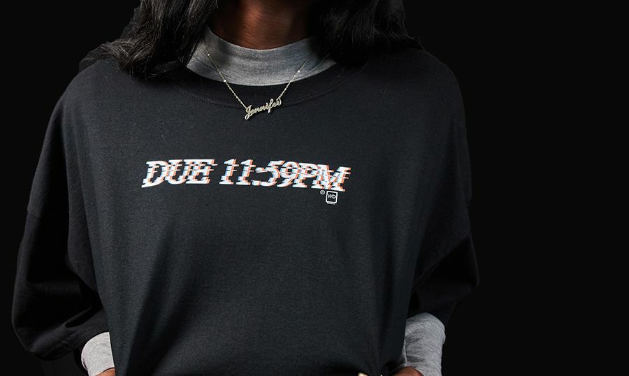 A girl wearing a shirt by WeDefined that has a text that reads, 'Due 11:59PM'