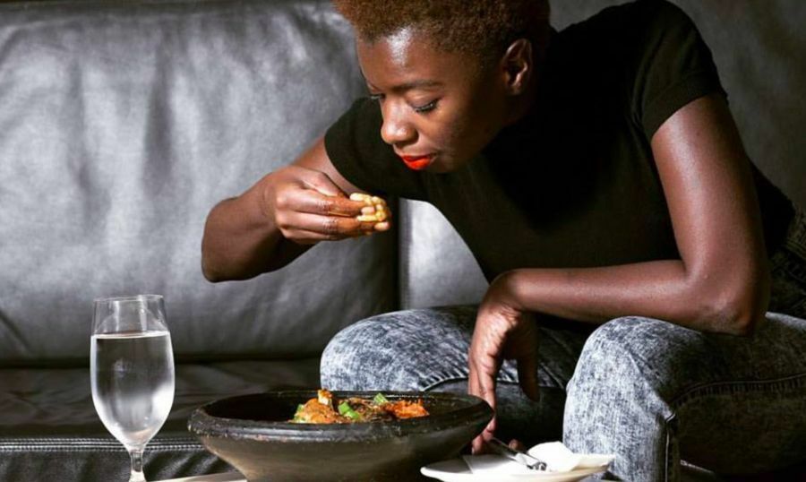 girl eating fufu at Golden Stool restaurant