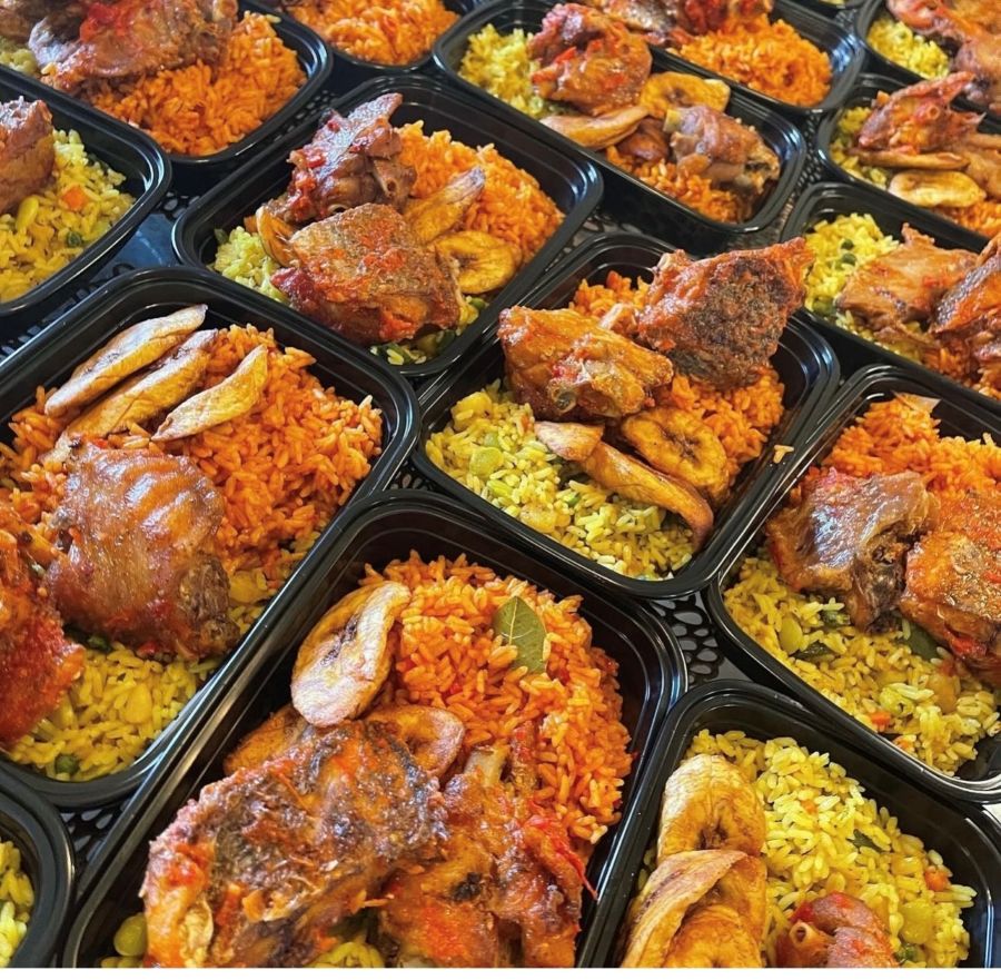 Organized containers of jollof fried rice and chicken