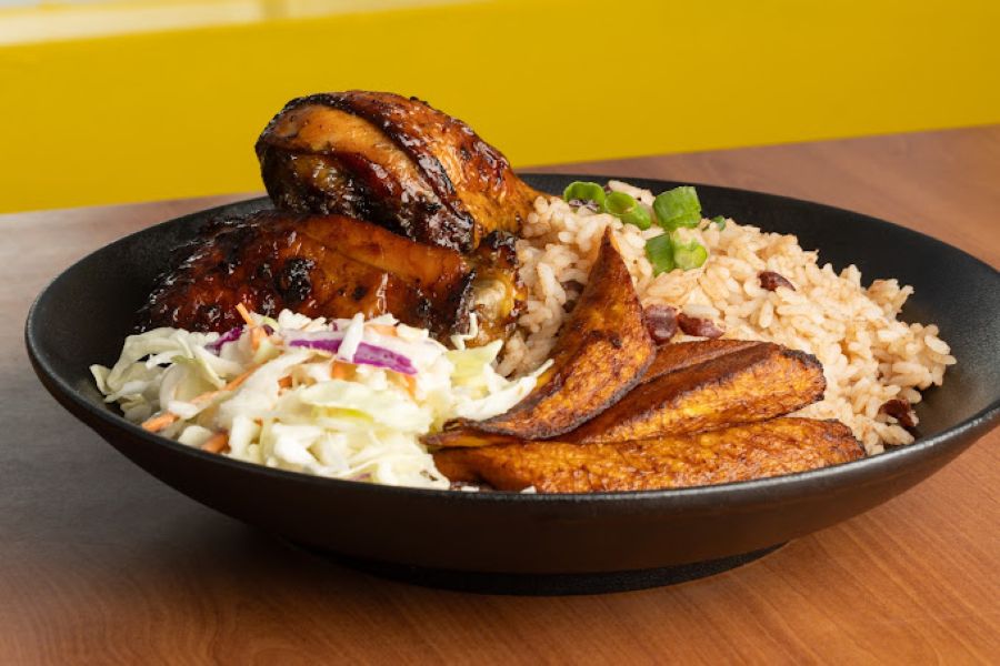 Chicken and rice with a side of plantain and coleslaw