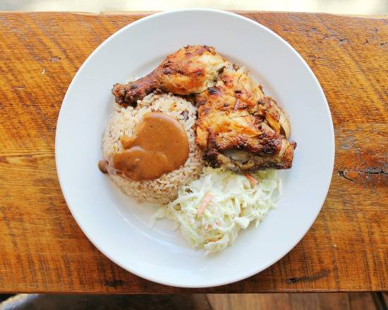 Chicken, rice and peas and coleslaw