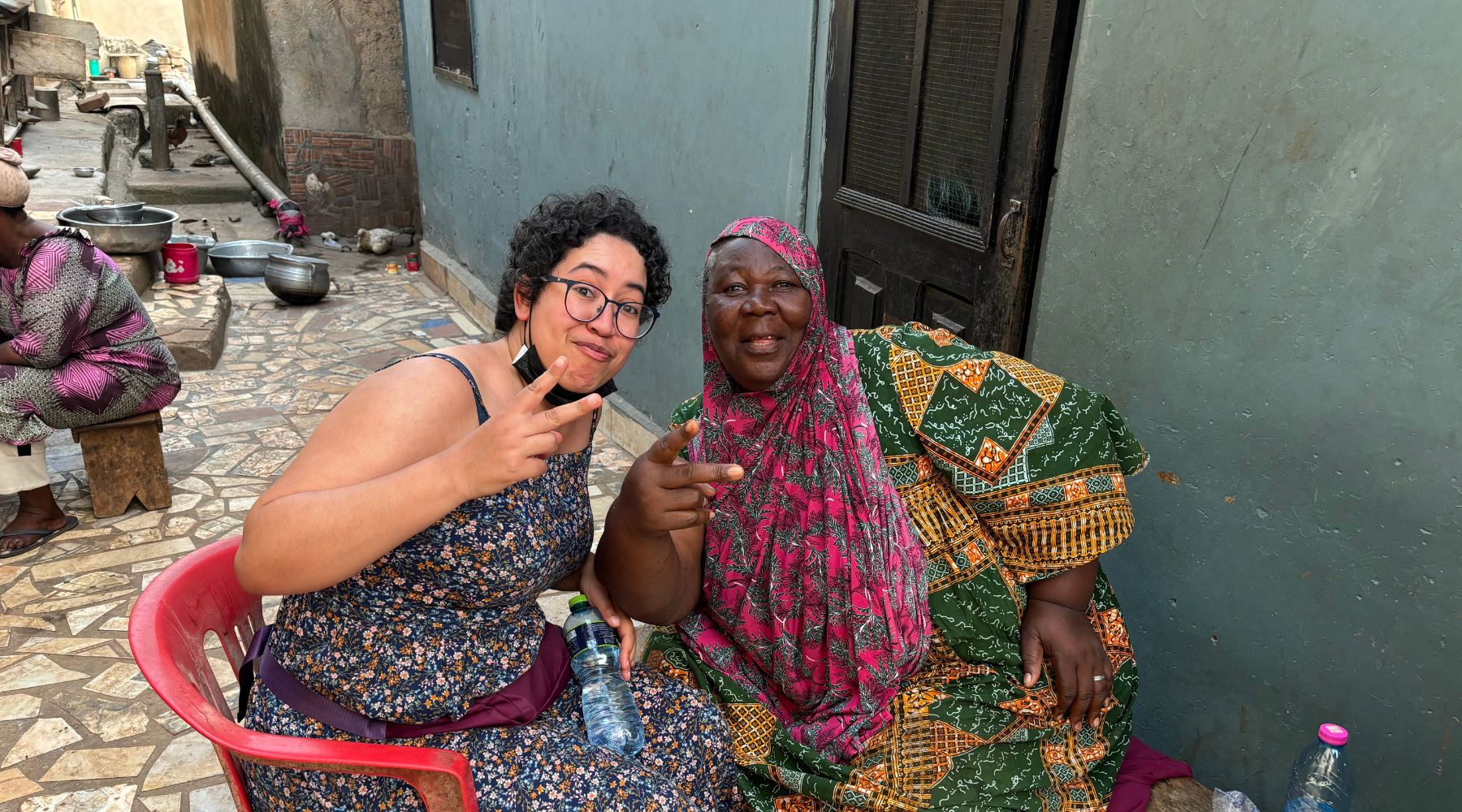 241214 My neighbour Hajia Fati right posing with me in front of her house