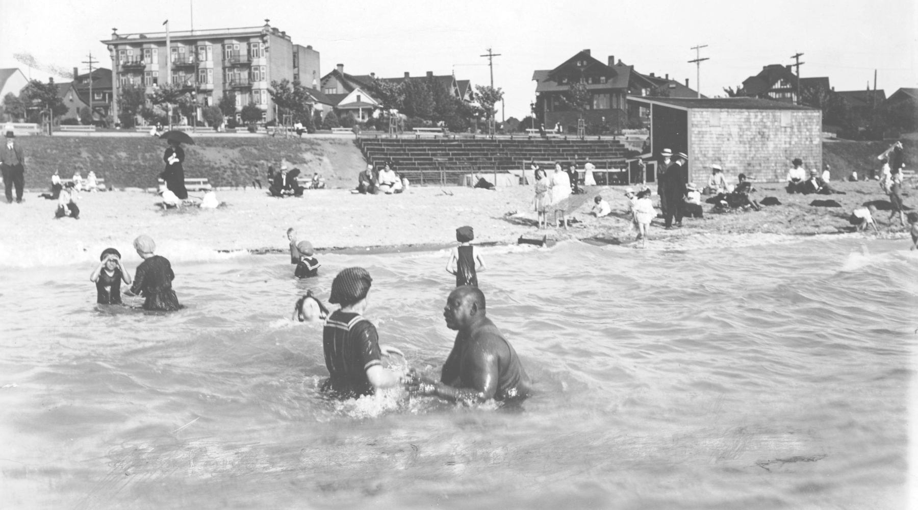 250221 Joe Fortes teaching a woman how to swim Vancouver Archives