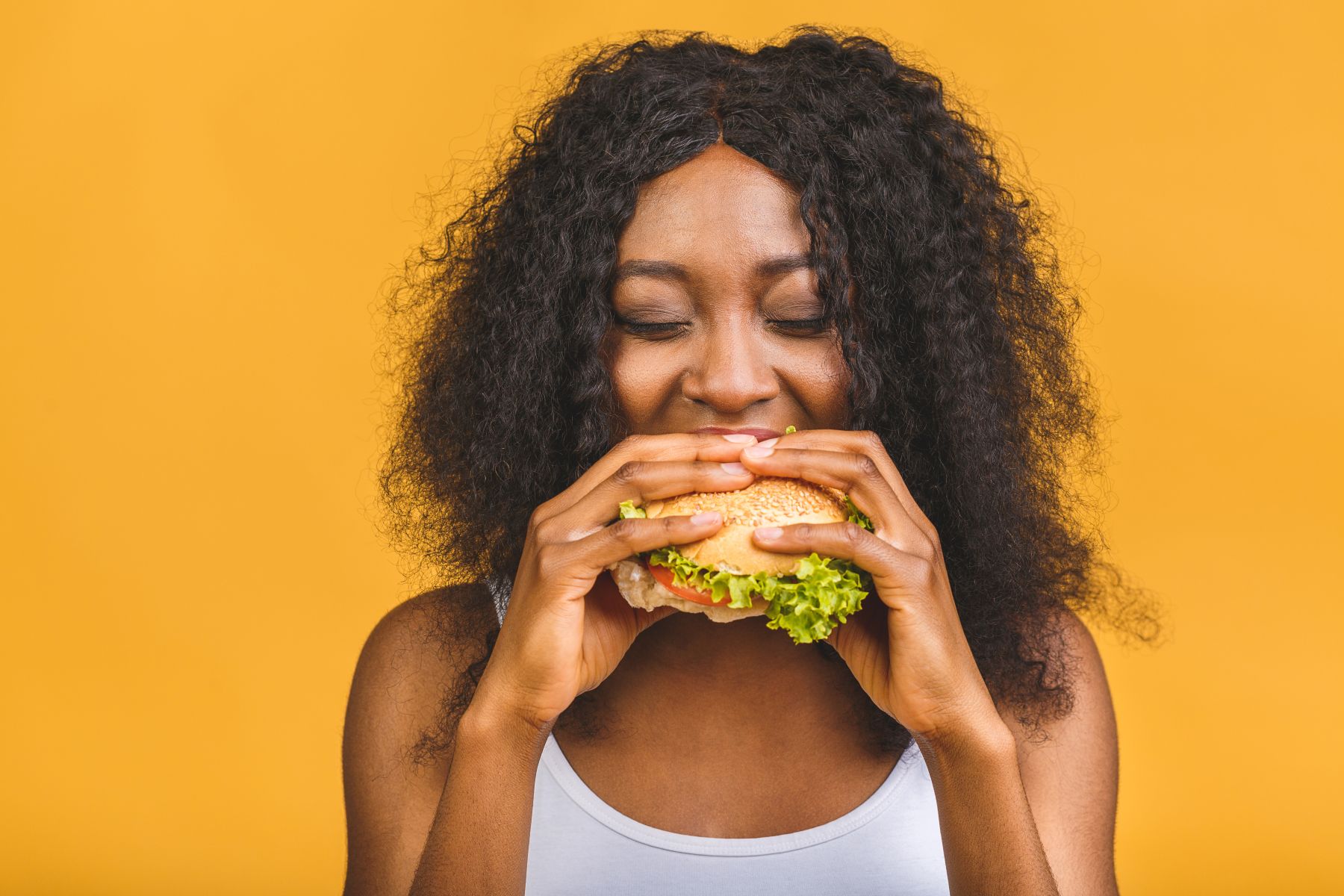 Woman eating a burger