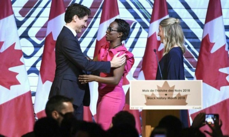 Prime Minister Justin Trudeau is welcomed by Parliamentary Secretary to the Minister of International Development Celina Caesar-Chavannes during a Black History Month reception at the Museum of History in Gatineau, Que. 