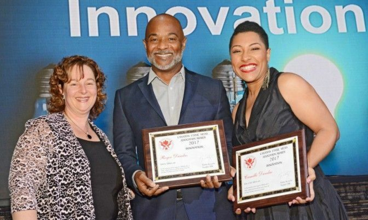 Karen Thorne-Stone from Ontario Media Development Corporation presented Roger + Camille Dundas with the award