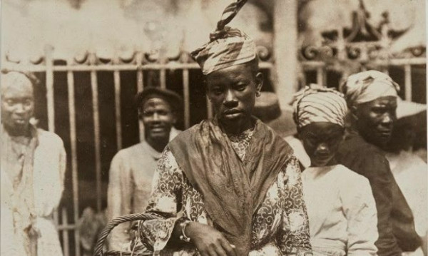 Unknown, At The Market, Martinique, ca 1895, 22.23 cm x 18.42, albumen print. Montgomery Collection of Caribbean Photographs. Purchase, with funds from Dr. Liza &amp; Dr. Frederick Murrell, Bruce Croxon &amp; Debra Thier, Wes Hall &amp; Kingsdale Advisors, Cindy &amp; Shon Barnett, Donette Chin-Loy Chang, Kamala-Jean Gopie, Phil Lind &amp; Ellen Roland, Martin Doc McKinney, Francilla Charles, Ray &amp; Georgina Williams, Thaine &amp; Bianca Carter, Charmaine Crooks, Nathaniel Crooks, Andrew Garrett &amp; Dr. Belinda Longe, Neil L. Le Grand, Michael Lewis, Dr. Kenneth Montague &amp; Sarah Aranha, Lenny &amp; Julia Mortimore, and Ferrotype Collective, 2019.