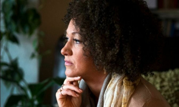In this March 2, 2015, file photo, Rachel Dolezal, president of the Spokane chapter of the NAACP, poses for a photo in her Spokane, Wash., home. Dolezal resigned Monday, June 15, 2015, amid a furor over racial identity that erupted when her parents came forward to say she has been posing as black for years when she is actually white. (Colin Mulvany/The Spokesman-Review via AP, File)