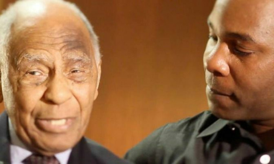 Kwame listens as Herb Carnegie tells his story