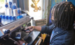 Johnson pouring coffee at 6City